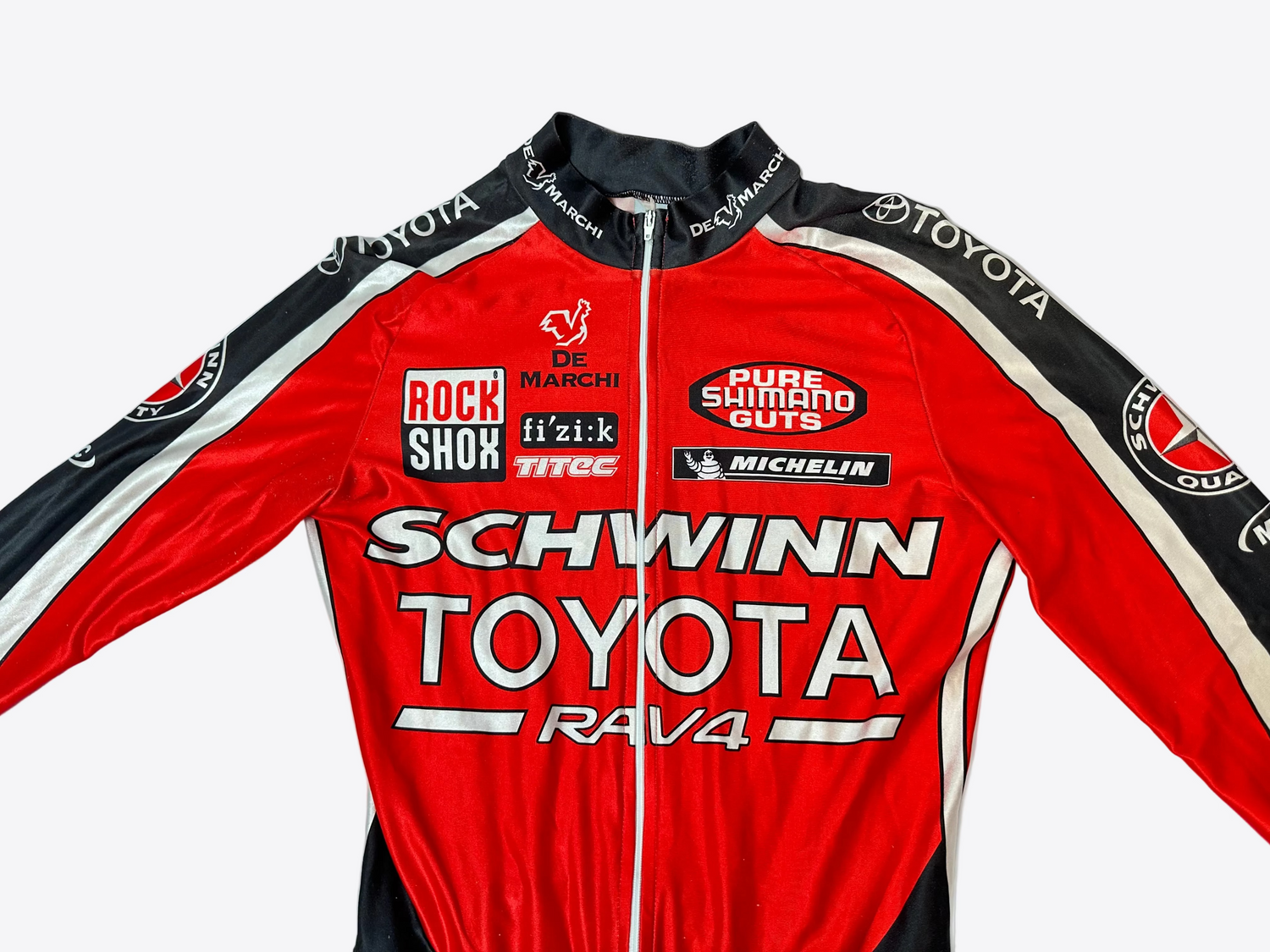 Red cycling jersey with various brand logos on a light blue background