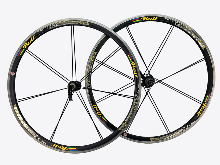 Two bicycle wheels with 'Rolf' branding on a white background