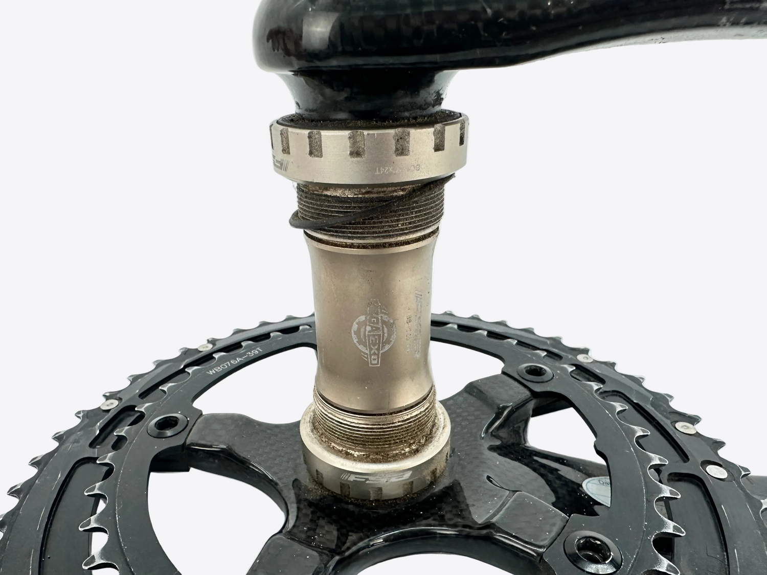 Close-up of a bicycle crankset on a white background