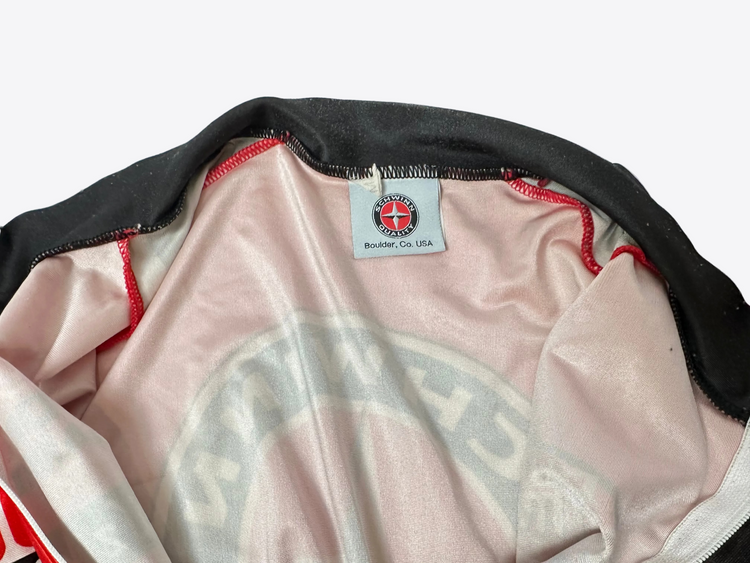 Close-up of a jacket with a brand label on a white background