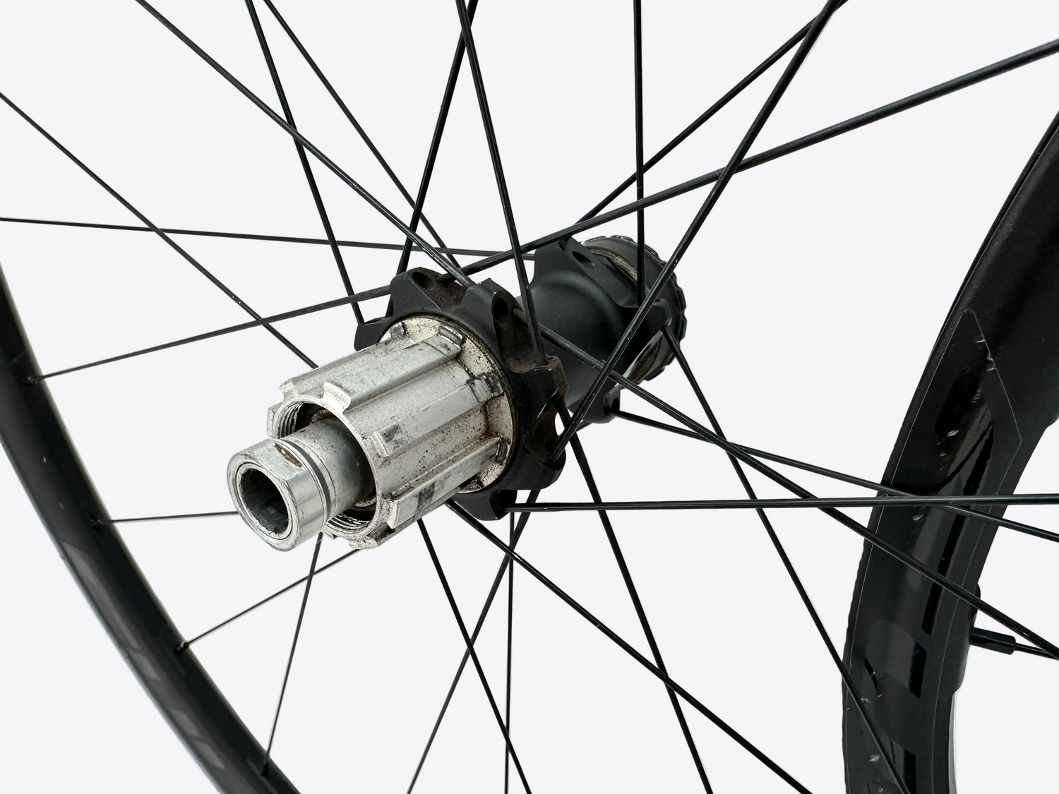 Close-up of a bicycle wheel hub on a white background