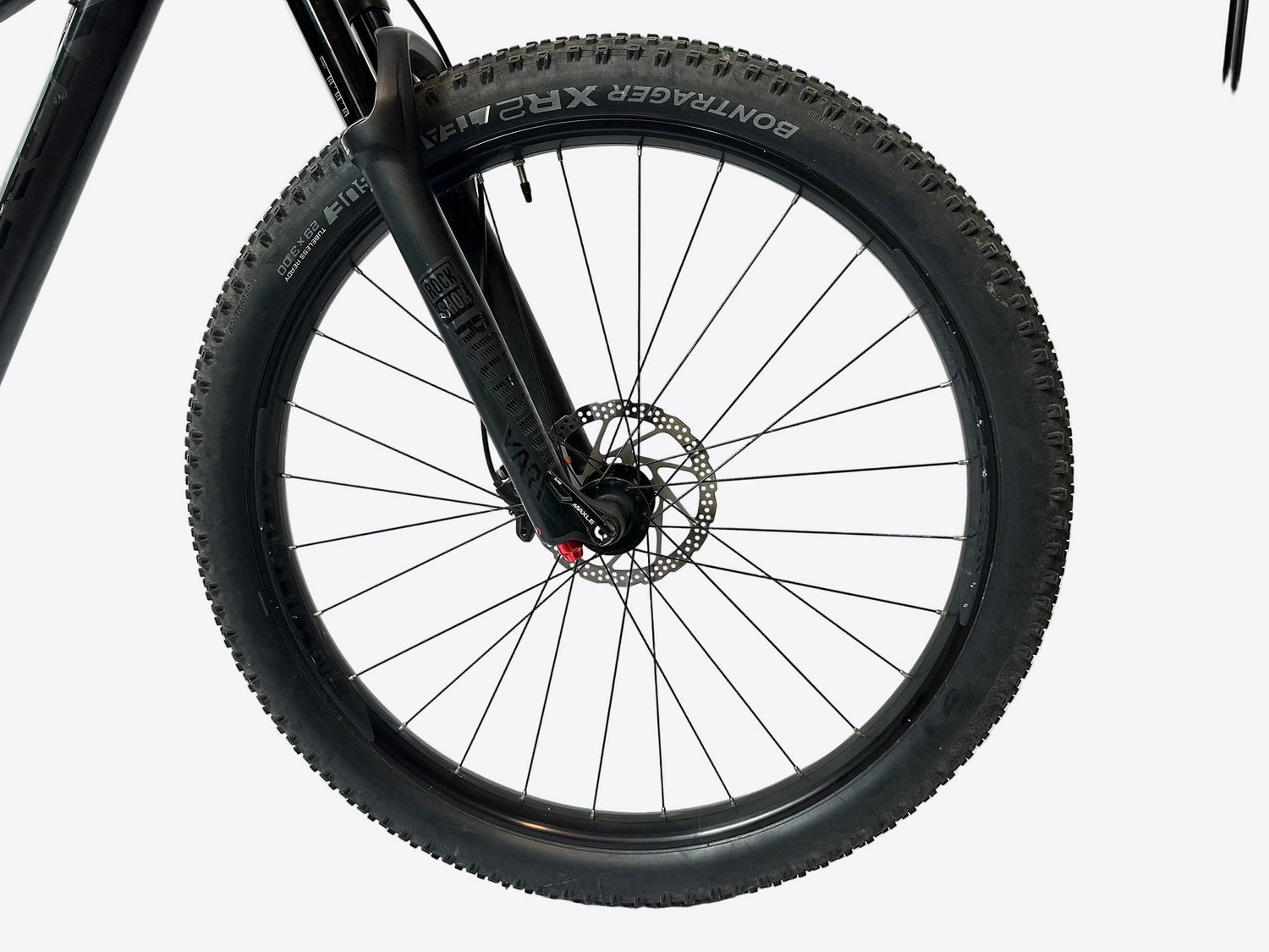Close-up of a bicycle wheel with a white background