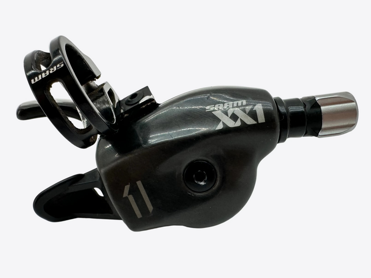 Black Sram XX1 bike shift lever on a light gray background
