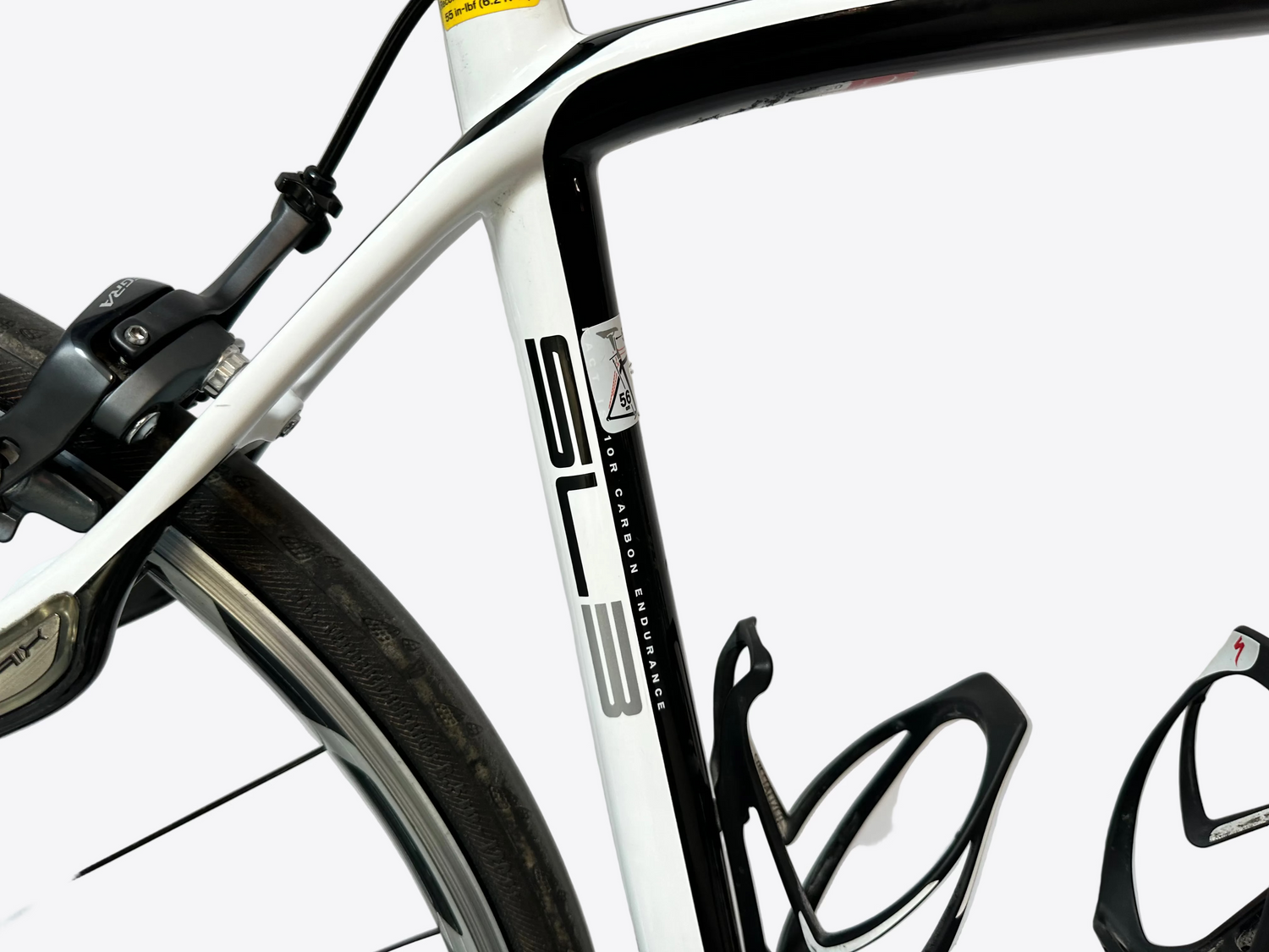 Close-up of a bicycle frame with branding on a white background
