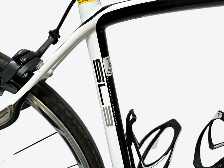 Close-up of a bicycle frame with branding on a white background