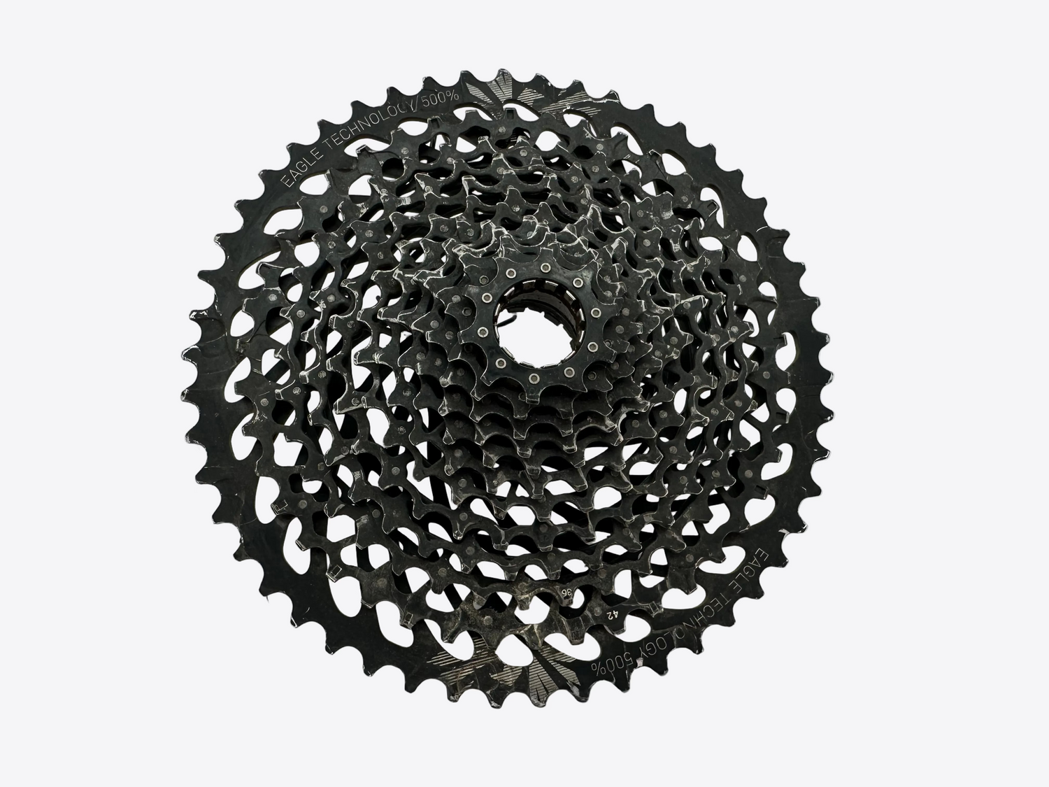 Black bicycle gear cassette on a white background