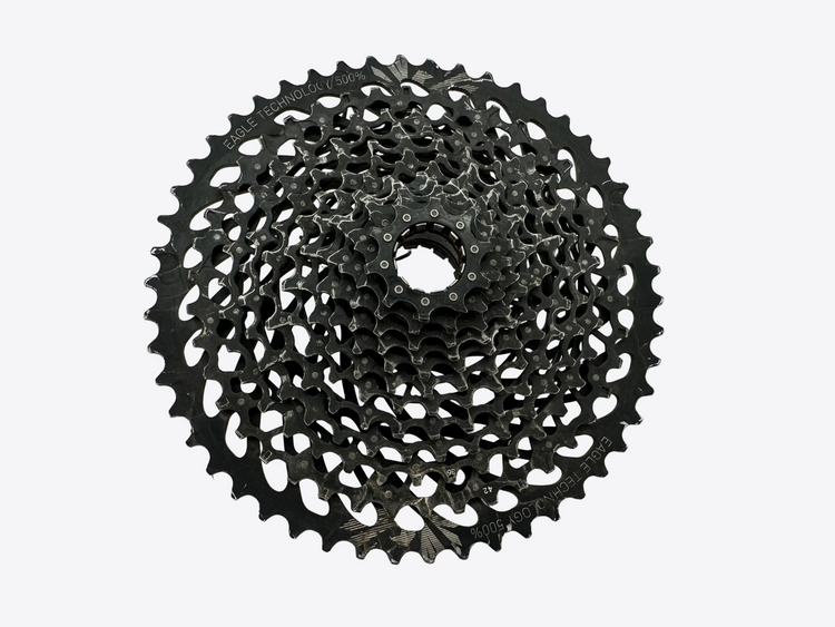 Black bicycle gear cassette on a white background