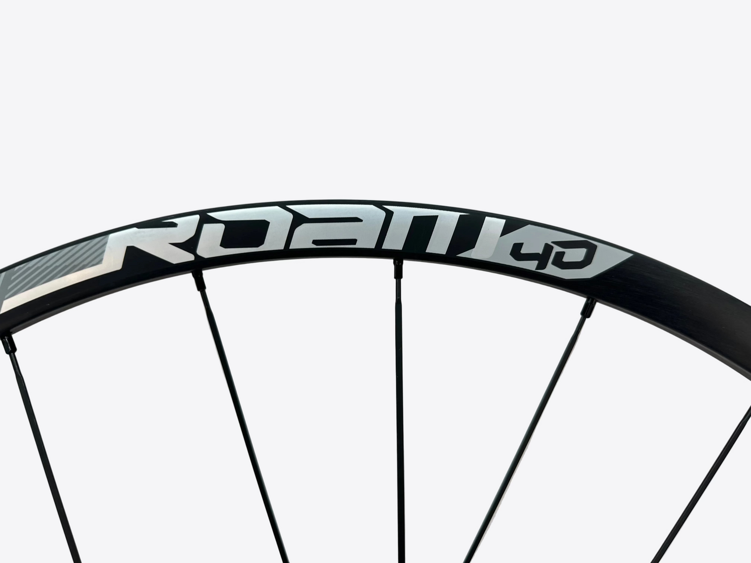 Bicycle wheel with Roam brand name on a light gray background