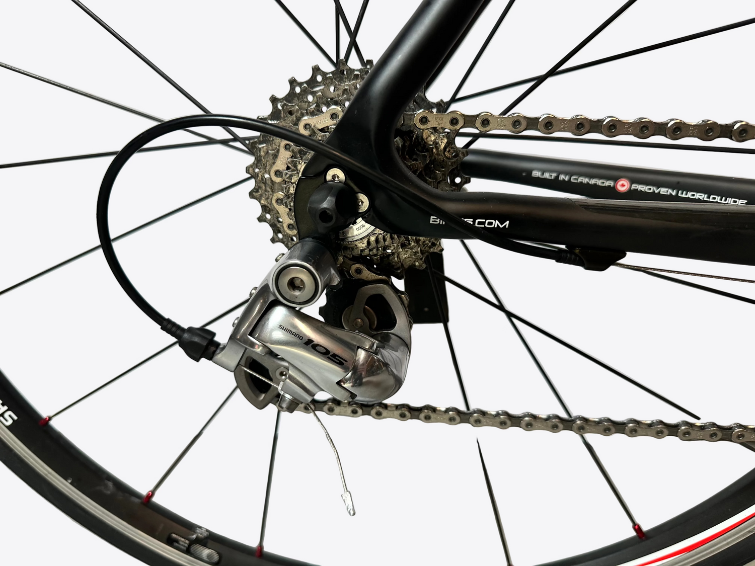 Close-up of a bicycle's gear system with a white background