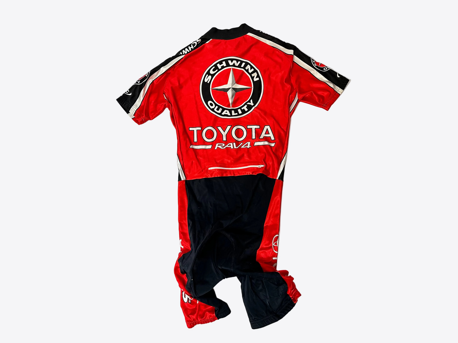 Red and black racing suit with Toyota and Schwinn logos on a white background