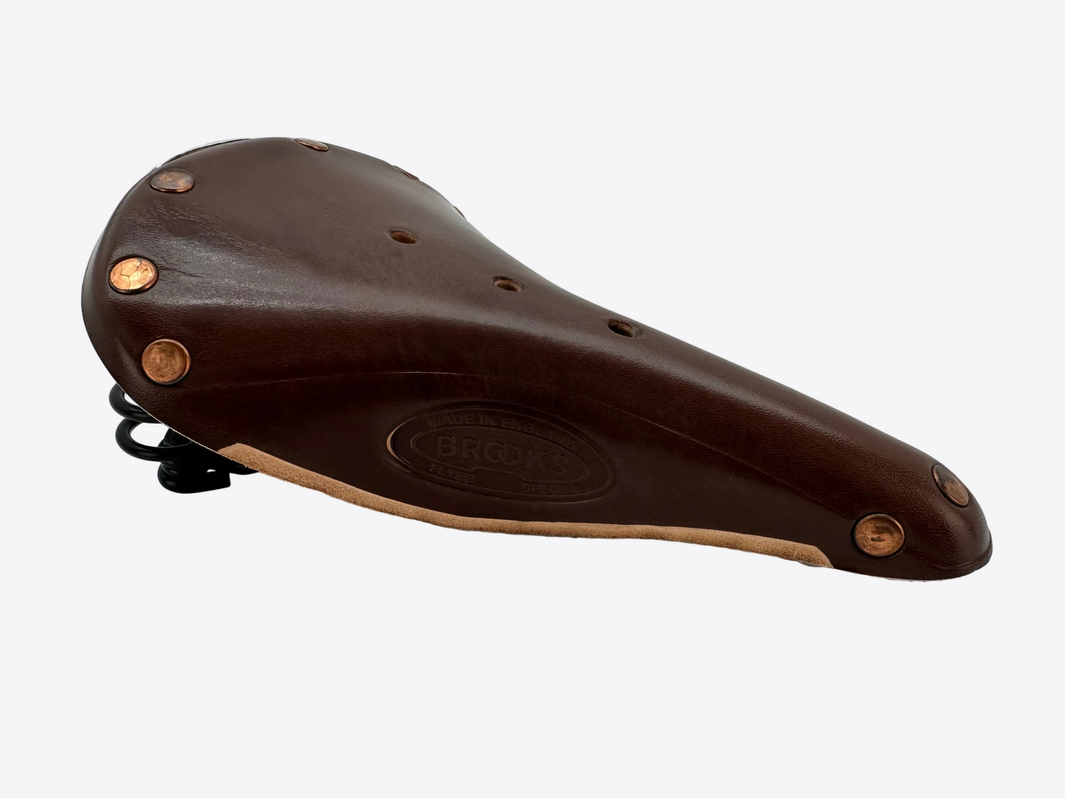 Brown leather bicycle seat with gold rivets on a white background
