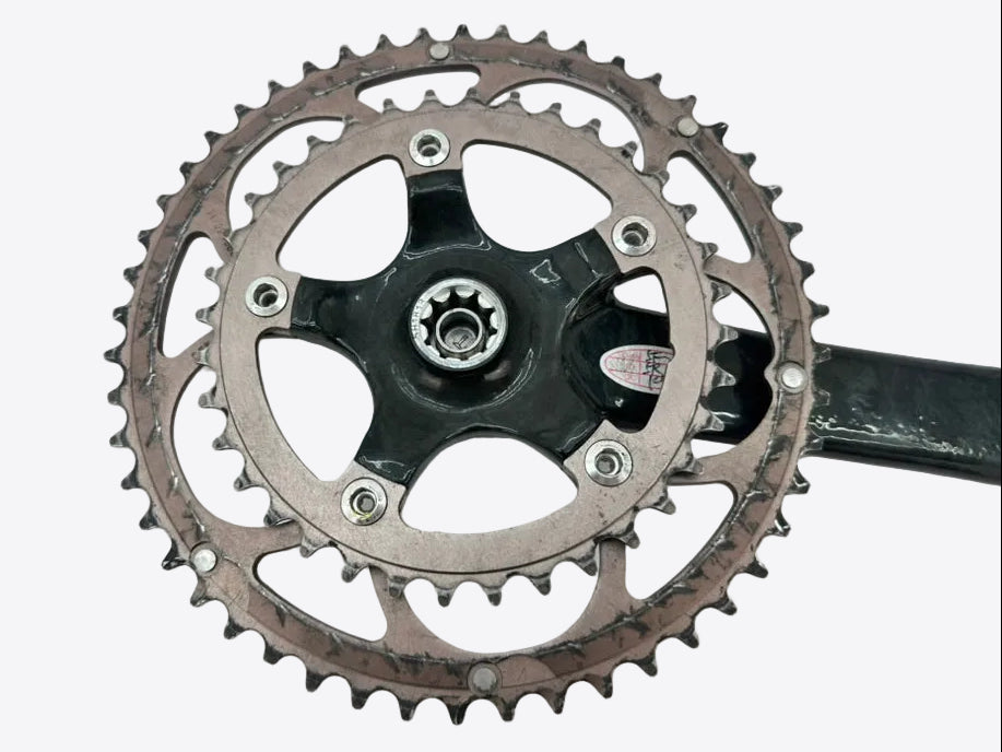 Bicycle crankset with chainring on a white background