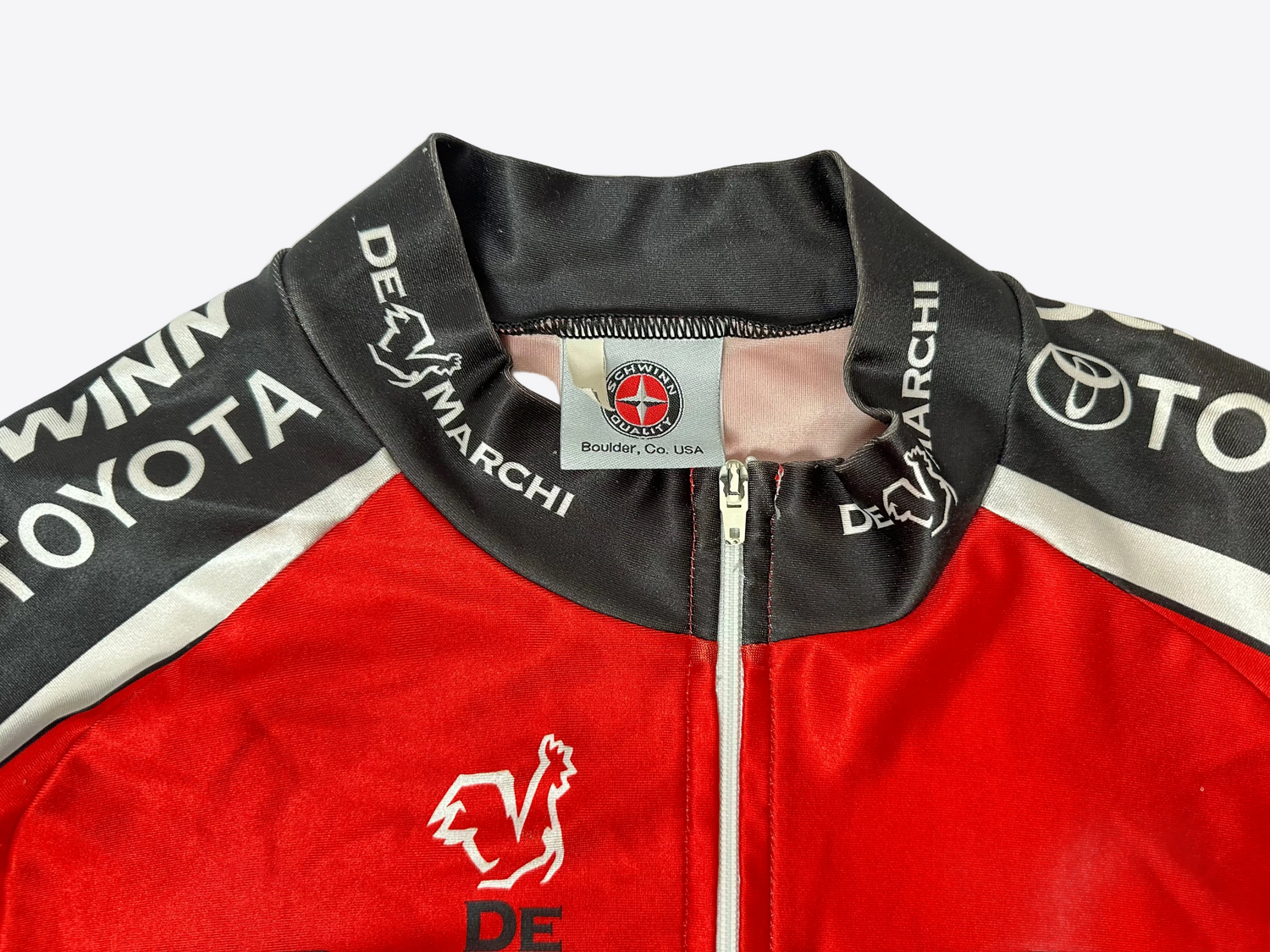 Red and black jacket with Toyota and De Marchi logos on a white background