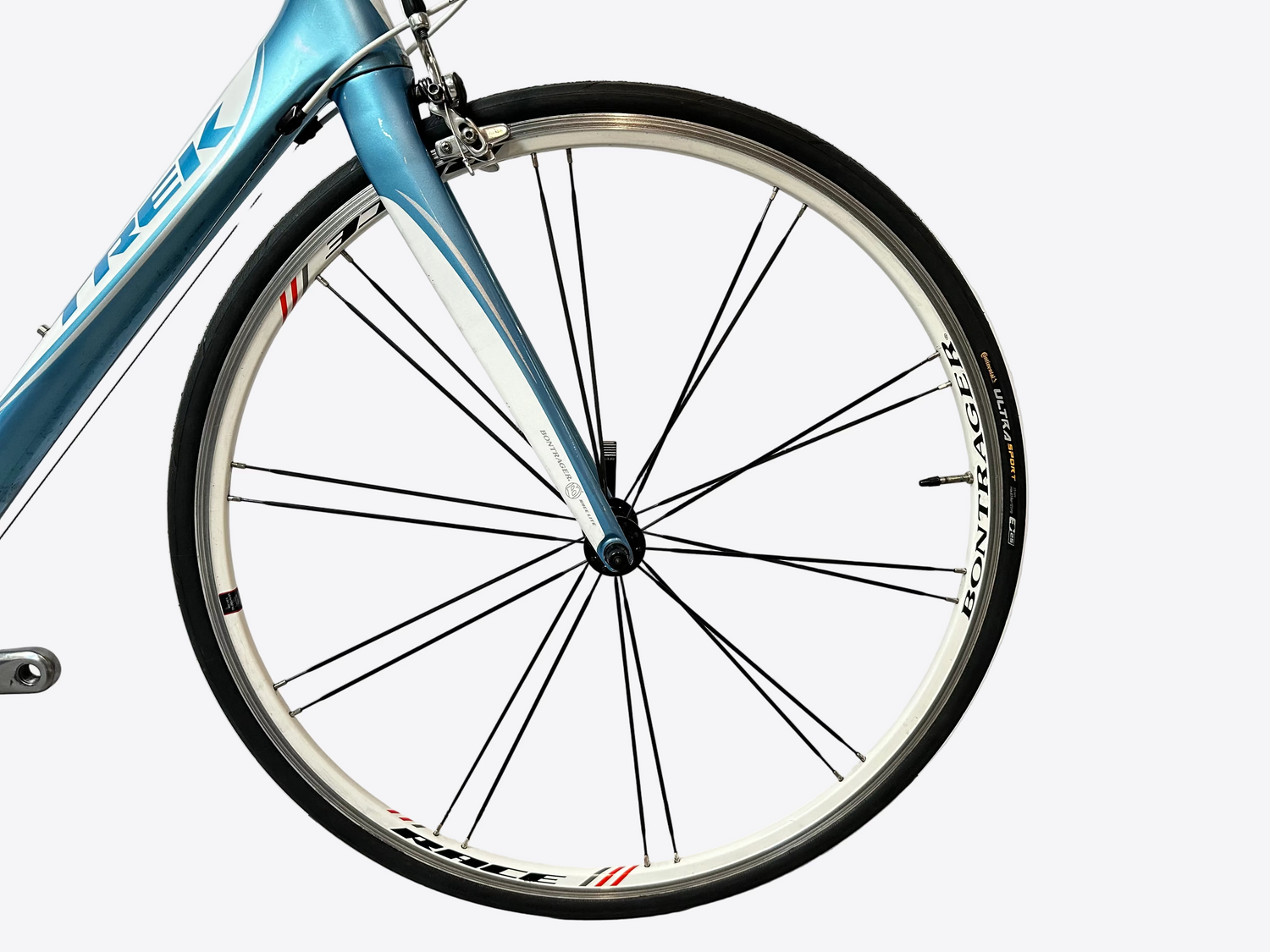 Close-up of a bicycle wheel with a white background