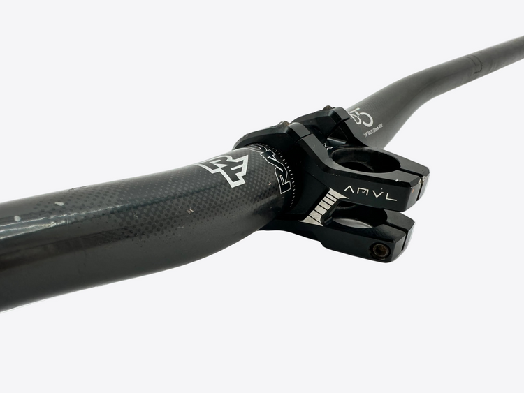 Close-up of a bicycle handlebar with 'ANVL' branding on a light gray background
