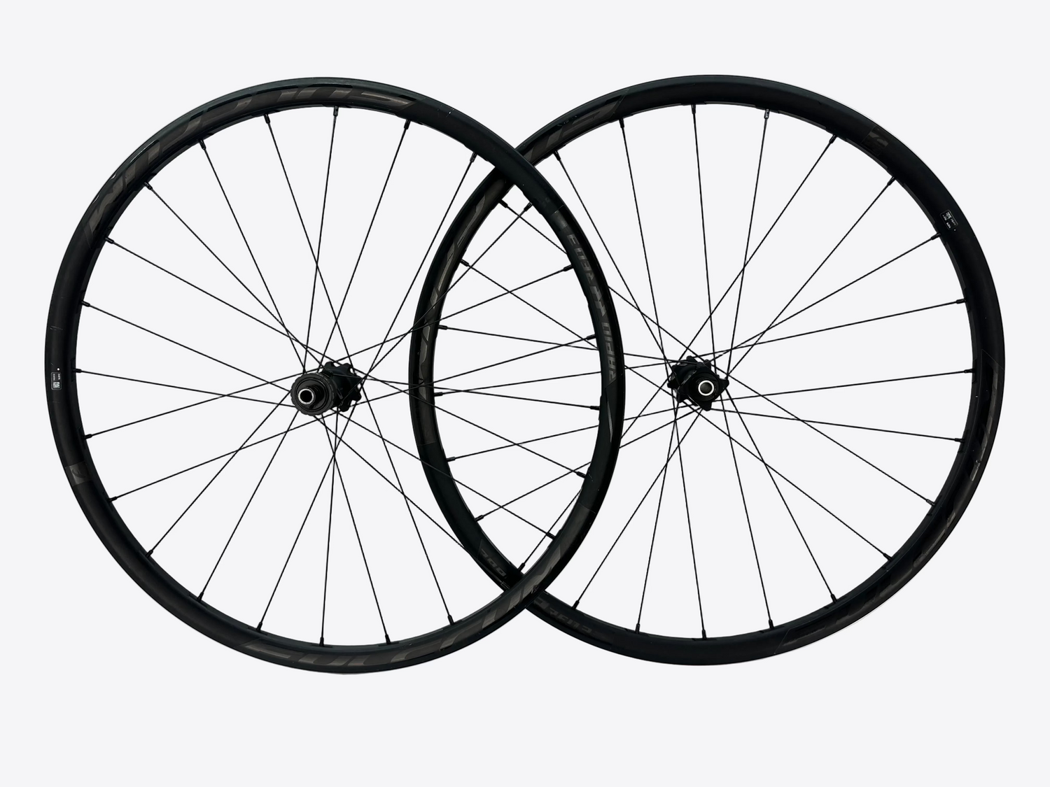 Two bicycle wheels on a white background