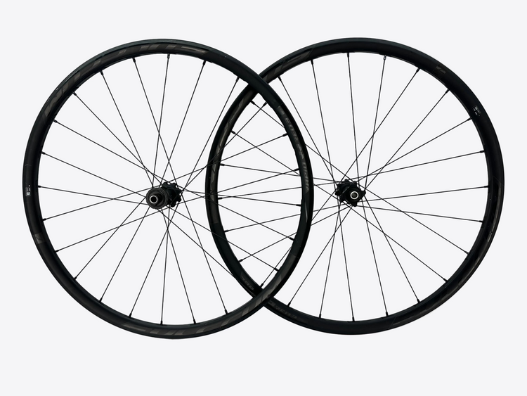 Two bicycle wheels on a white background
