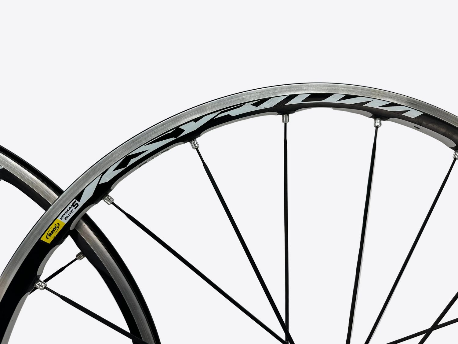 Close-up of a bicycle wheel with a white background