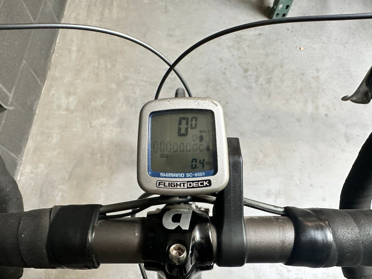 Bicycle computer on handlebars with a blurred background