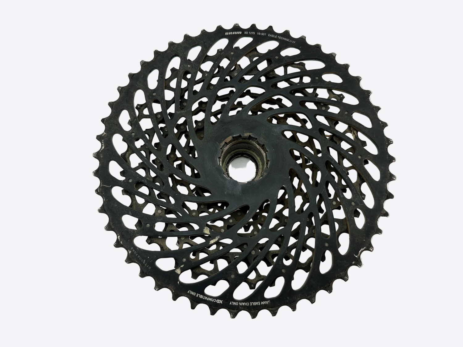 Black bicycle gear cassette on a white background