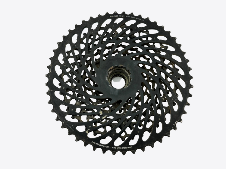Black bicycle gear cassette on a white background