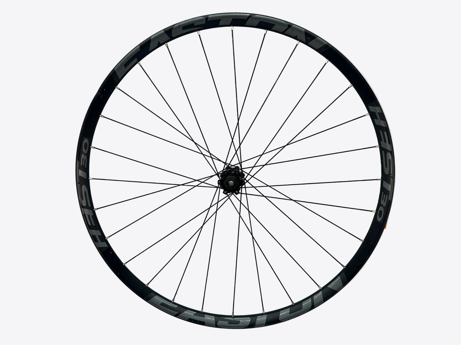 Bicycle wheel with black rim and spokes on a white background