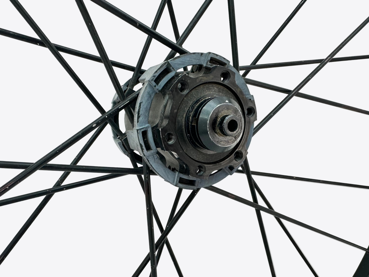 Close-up of a bicycle wheel hub on a white background