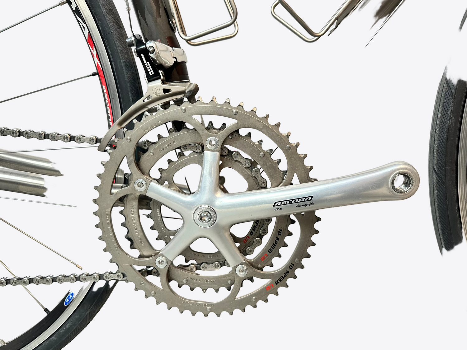Close-up of a bicycle's gear system with a white background
