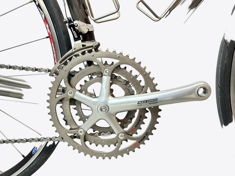Close-up of a bicycle's gear system with a white background