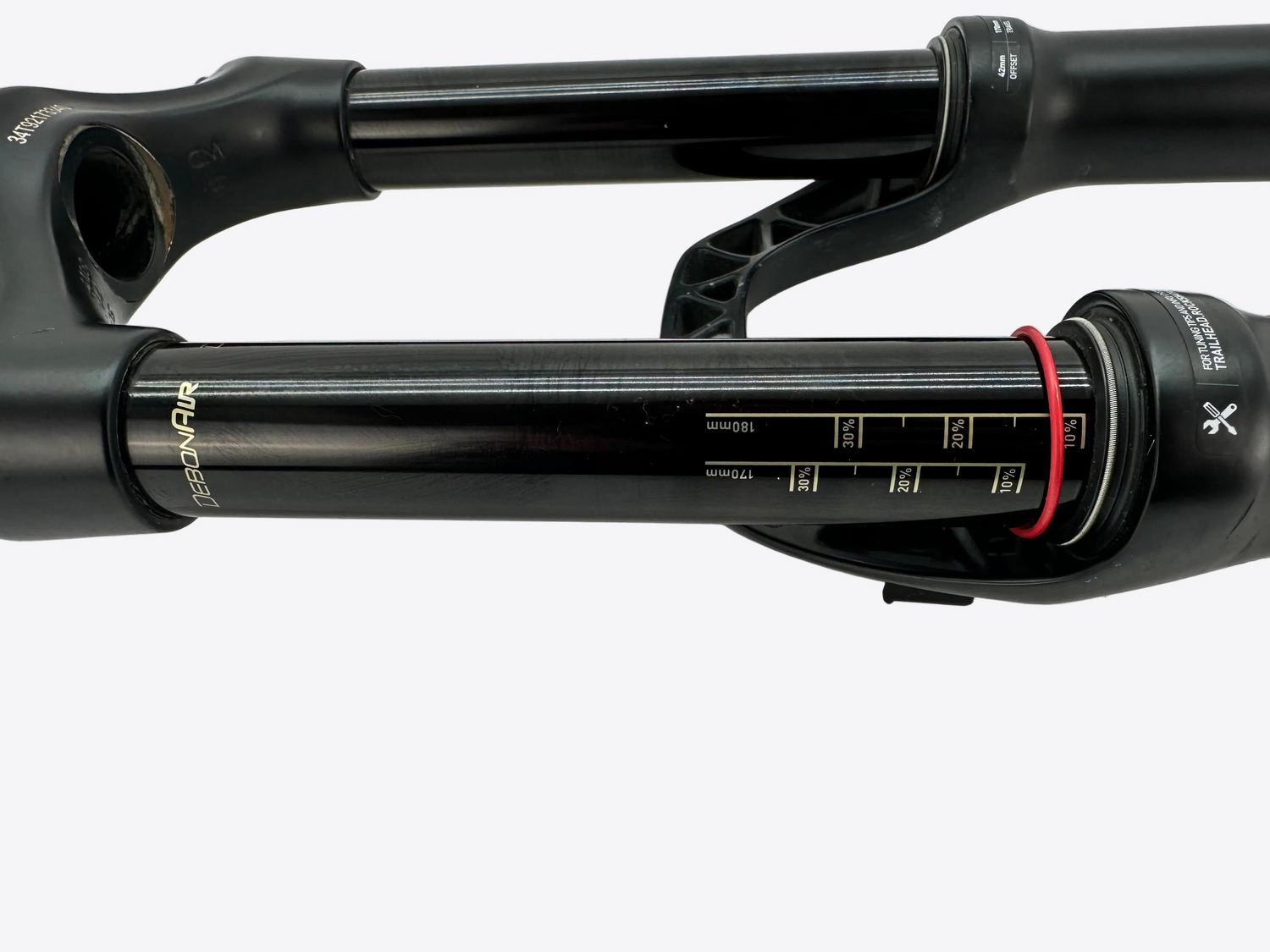 Close-up of a bicycle suspension fork on a white background