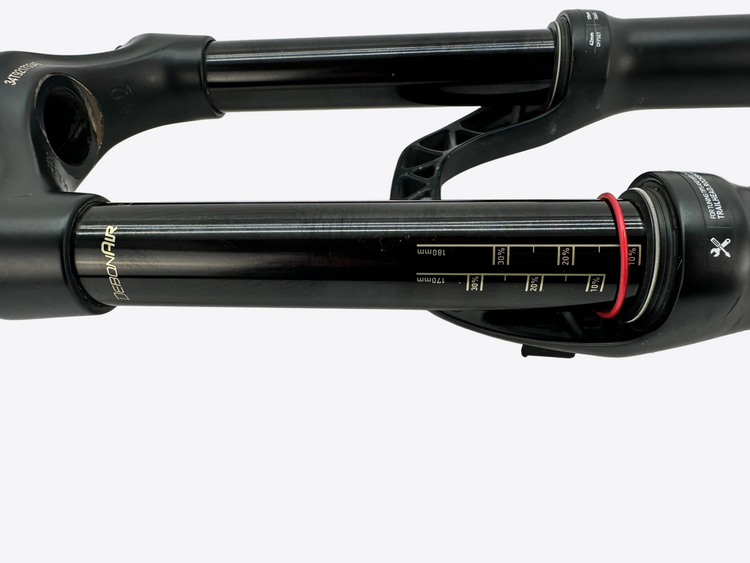 Close-up of a bicycle suspension fork on a white background