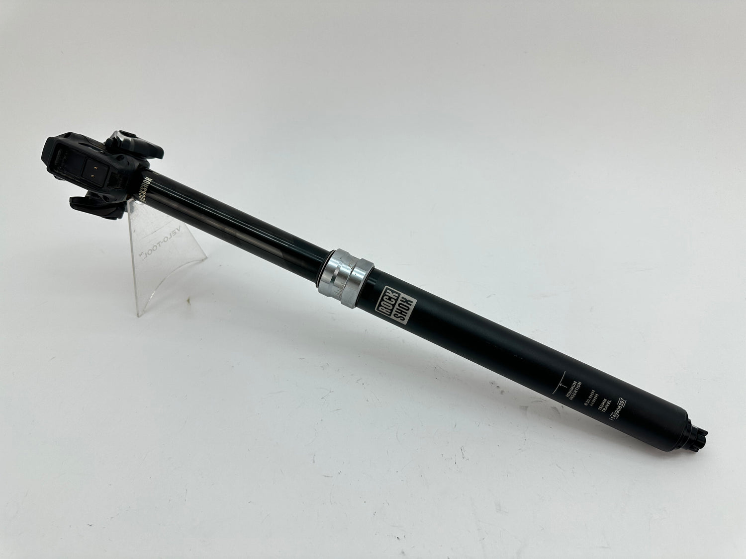 Black bicycle seatpost on a white background