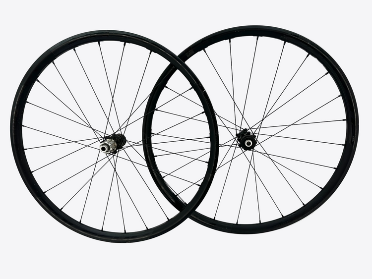 Two bicycle wheels on a white background