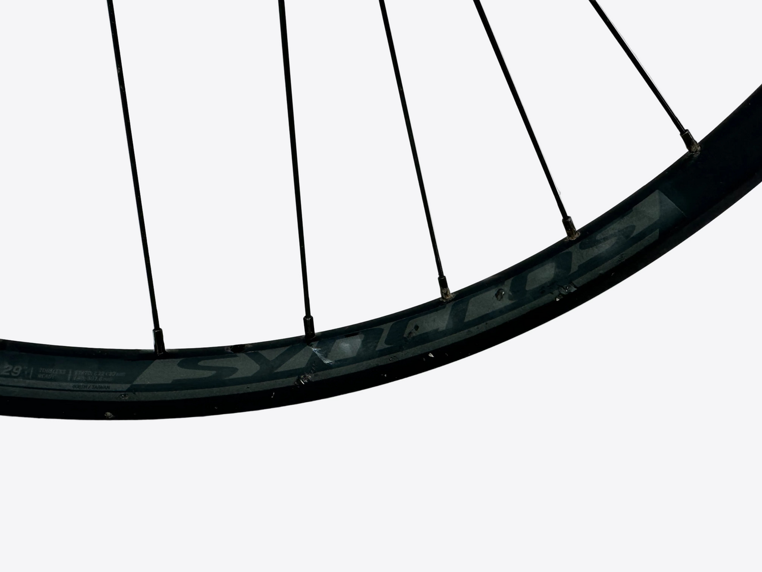 Close-up of a bicycle wheel rim on a white background