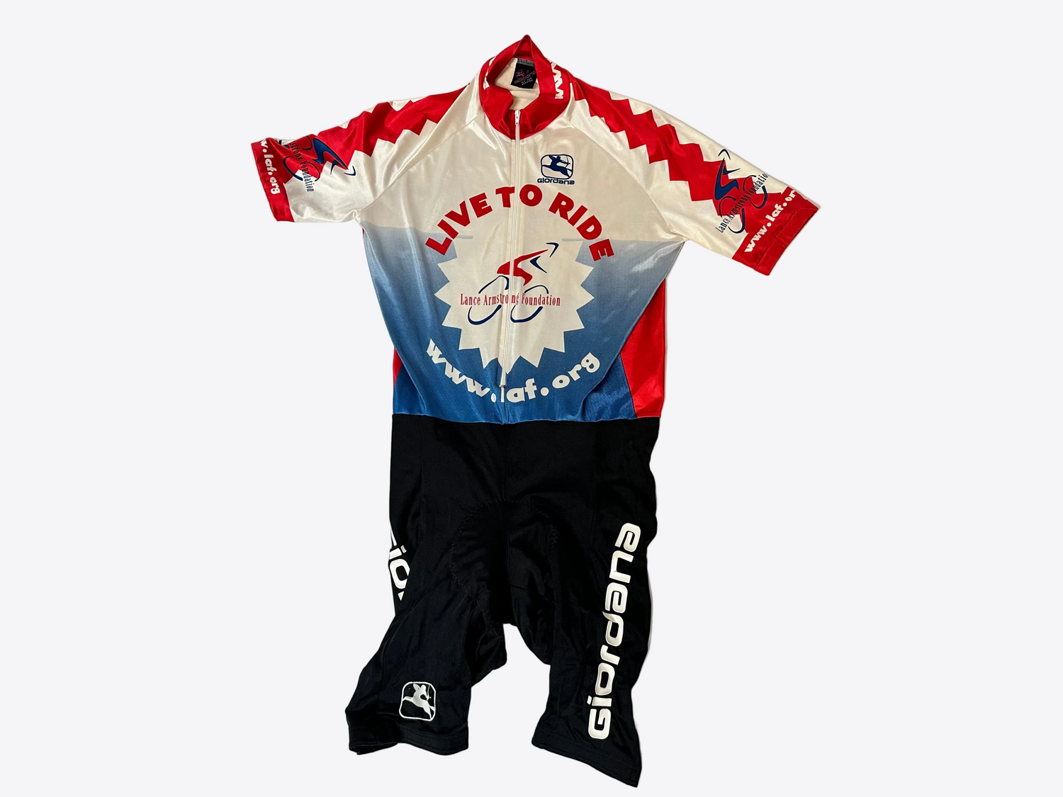 Cycling jersey and shorts with visible branding on a light gray background