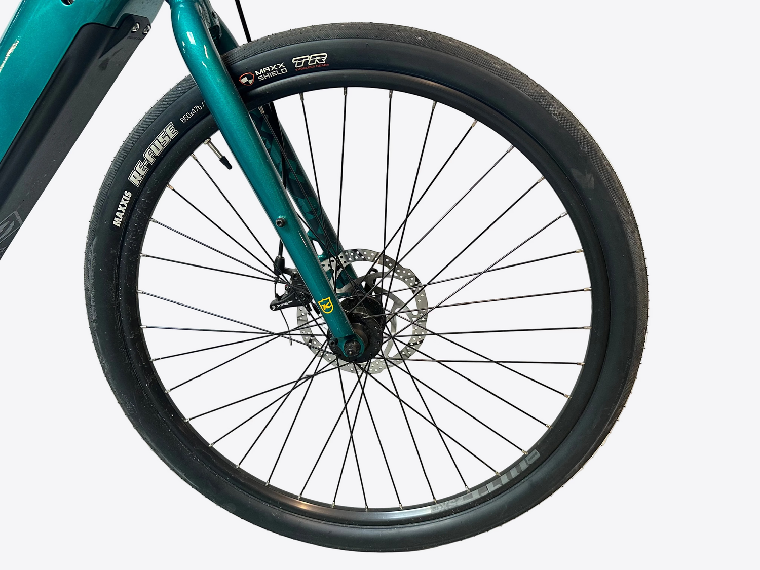 Close-up of a bicycle wheel with a white background