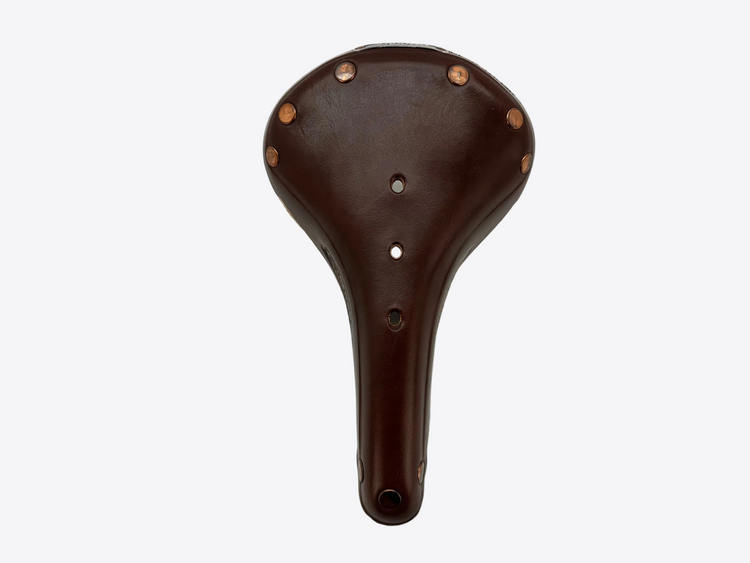 Brown leather bicycle seat with metal studs on a light gray background
