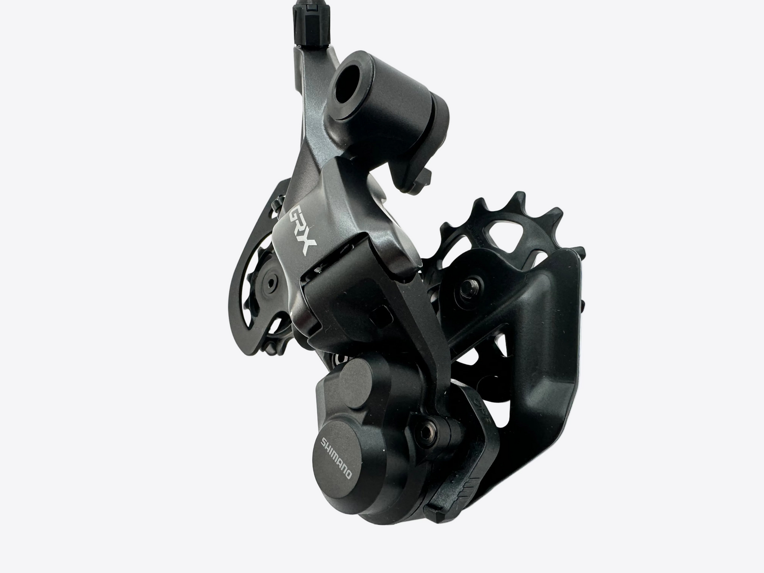 A black Shimano GRX rear derailleur component photographed on a plain white studio background.