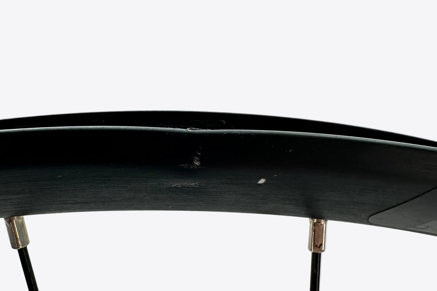 Close-up of a bicycle wheel with a white background