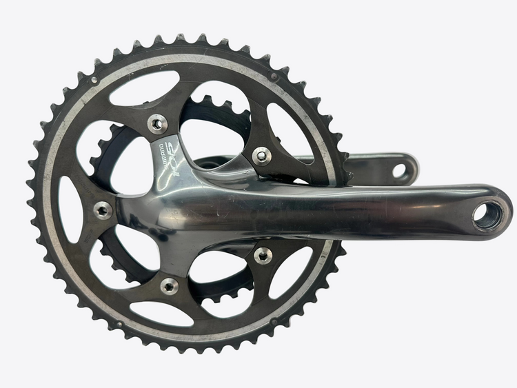 Bicycle crankset with chainrings on a white background
