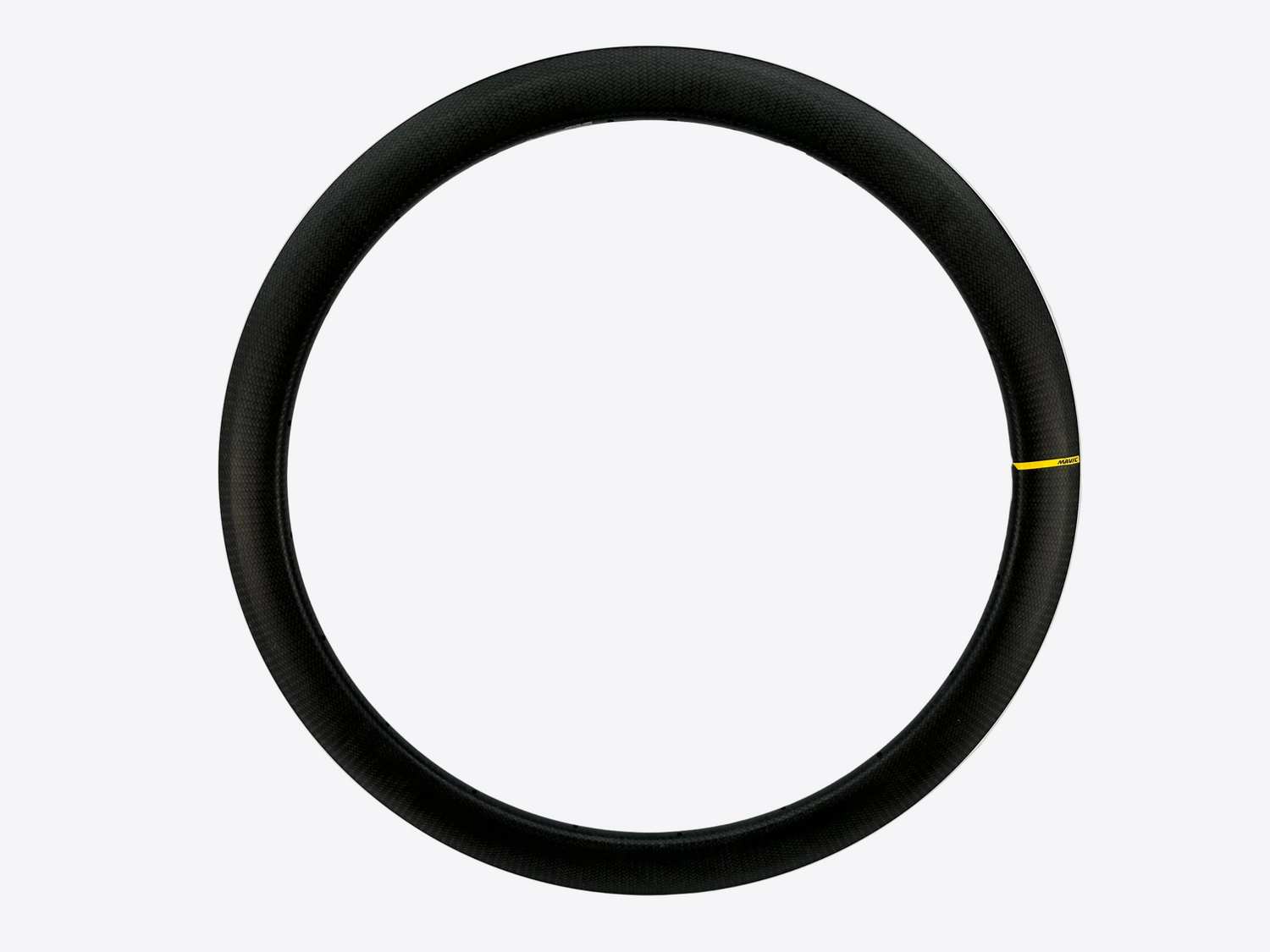 A black carbon fiber bicycle wheel rim shown against a plain white background, featuring a small yellow marking on the right side.