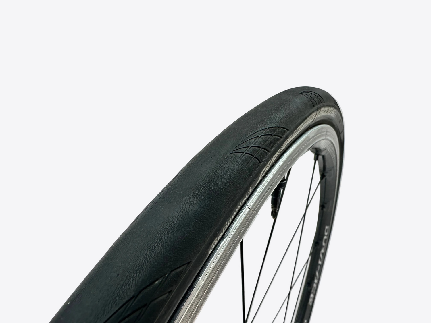 Close-up of a bicycle tire with a white background