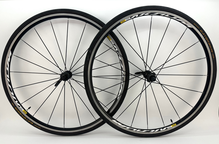 Two bicycle wheels with Mavic branding on a white background