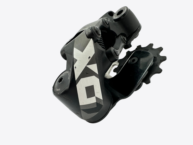Black bicycle derailleur with gear on a white background