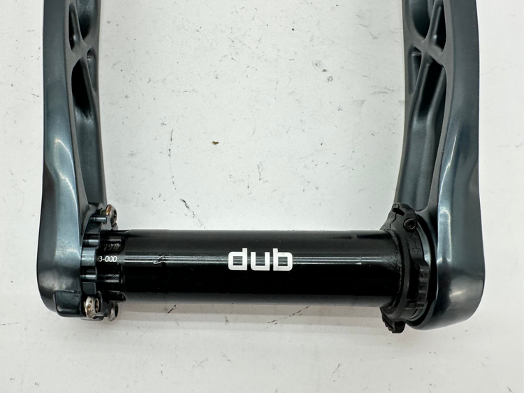 Bicycle crank with 'dub' branding on a white background