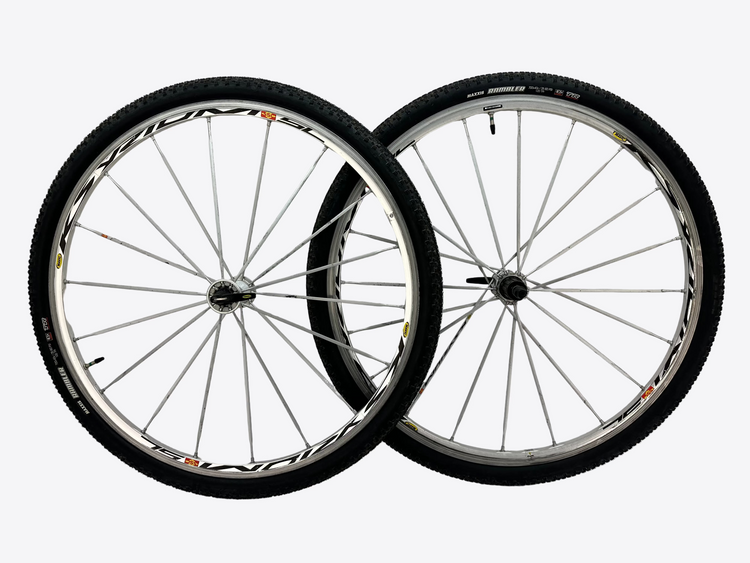Two bicycle wheels on a white background