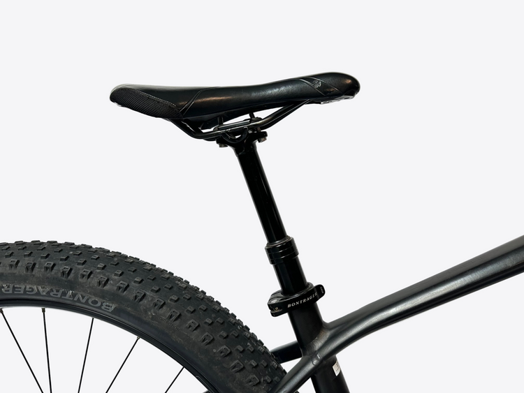Close-up of a bicycle seat and frame against a white background