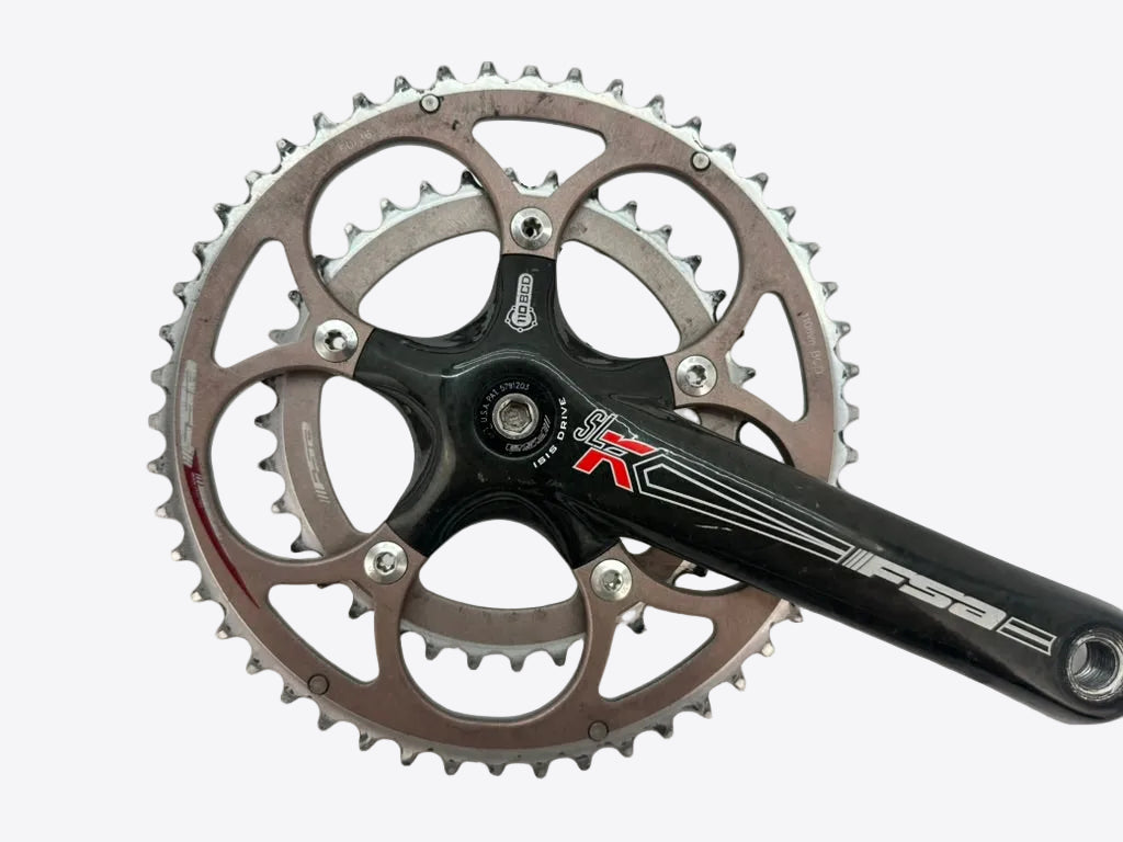 Bicycle crankset with chainring on a white background