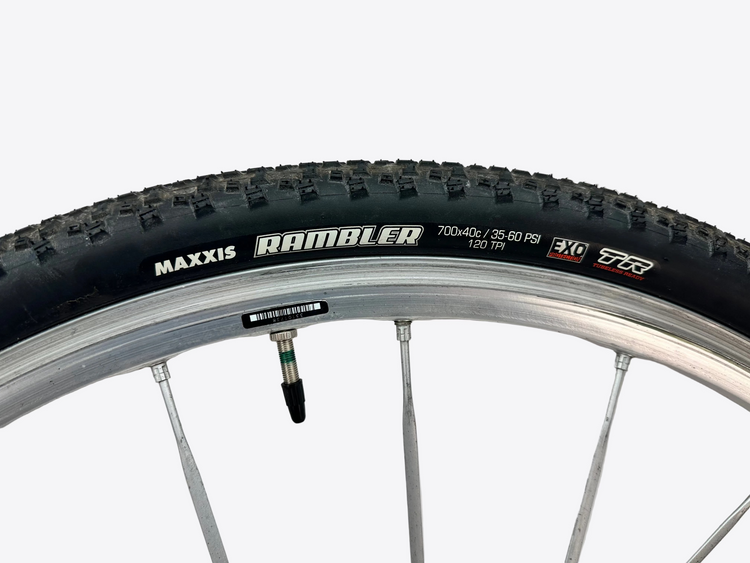 Maxxis Ramblin' bicycle tire with valve on a white background