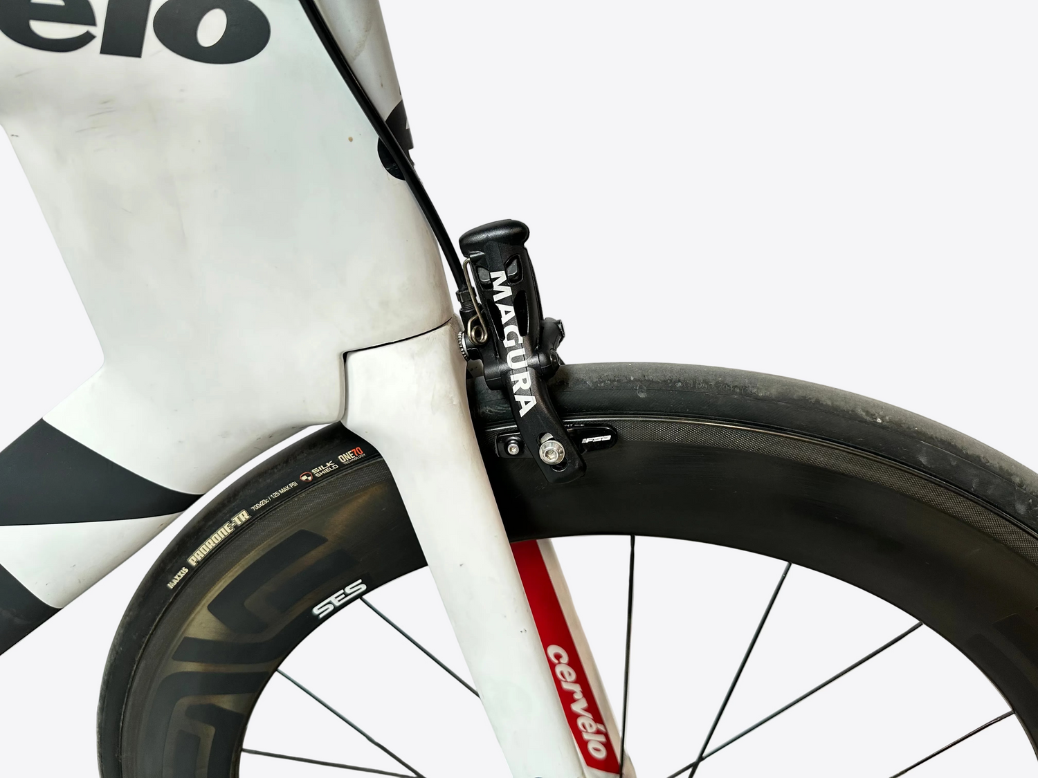 Close-up of a bicycle with Magura brake lever and Cervelo frame on a blurred background